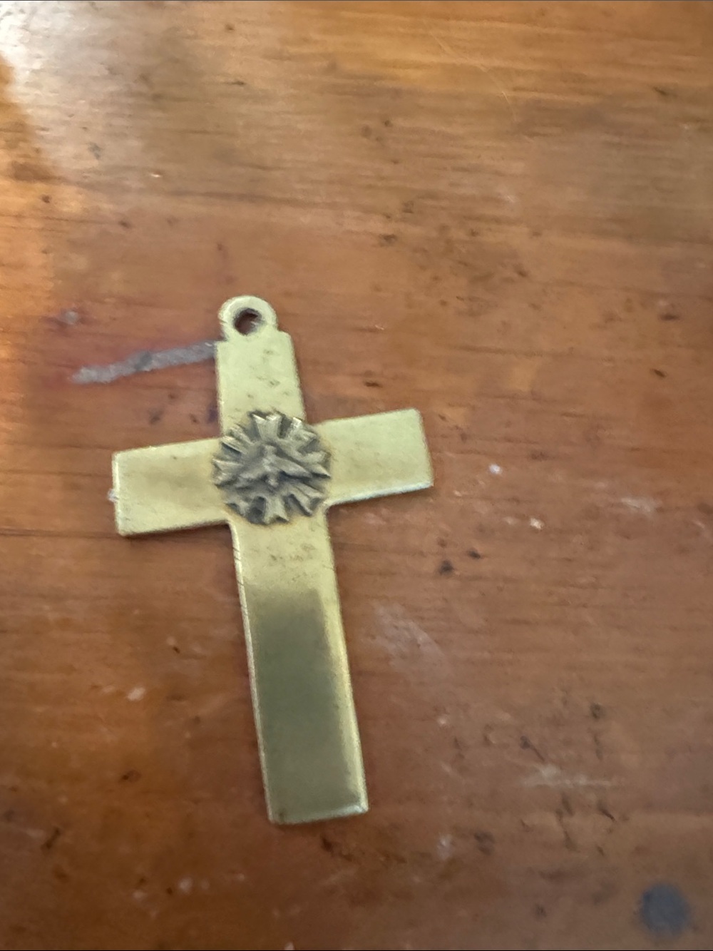 Gold Tone Cross Pendant with Starburst Accent